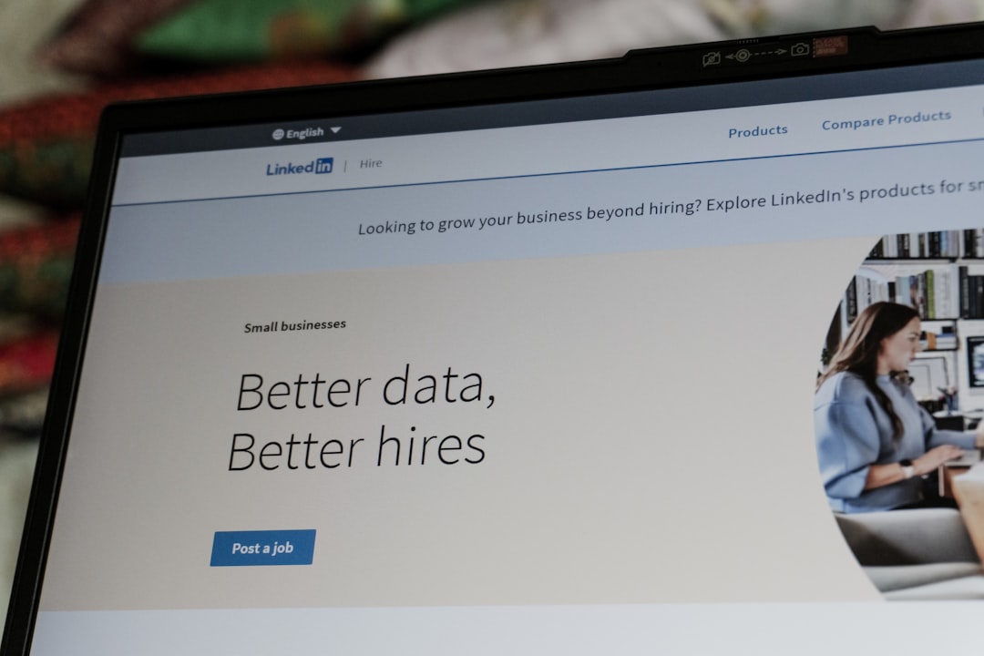 A laptop displays a website with the slogan βbetter data, better hires.β
